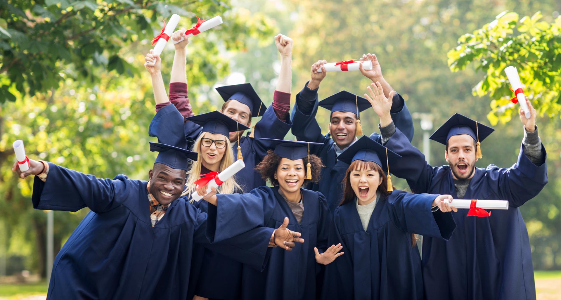 A group of graduating students, happy and excited to begin the next chapter of their lives