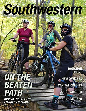 Riders, from left, Anne Schroll, Jessi Springer and Sarah Rochford take a break from traversing some of the nearly seven miles’ worth of trails at the Route 66 Hike & Bike Trail along Litchfield’s Lake Lou Yaeger.
