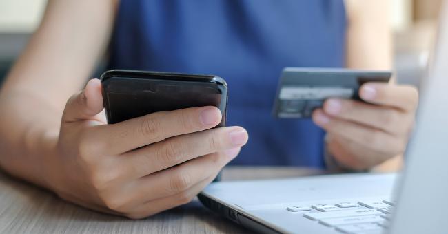 A woman paying her electric bill on the app.